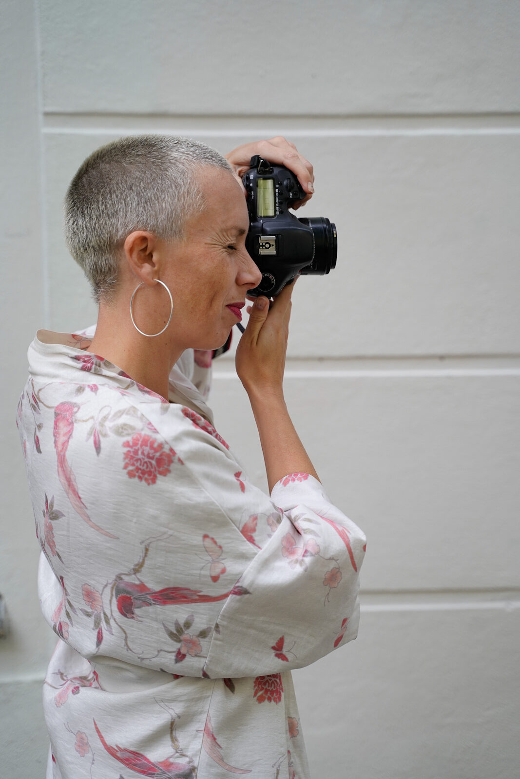 Portrait of a photographing female photographer
